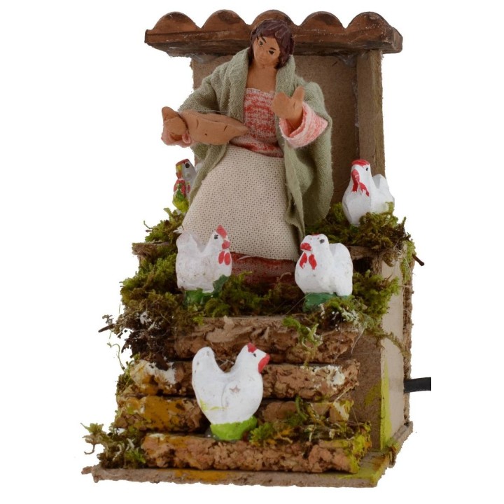 Donna che ciba le galline in movimento 10 cm