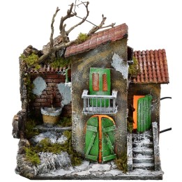 Casa iluminada con fuente funcionando de 30x21x35 cm h