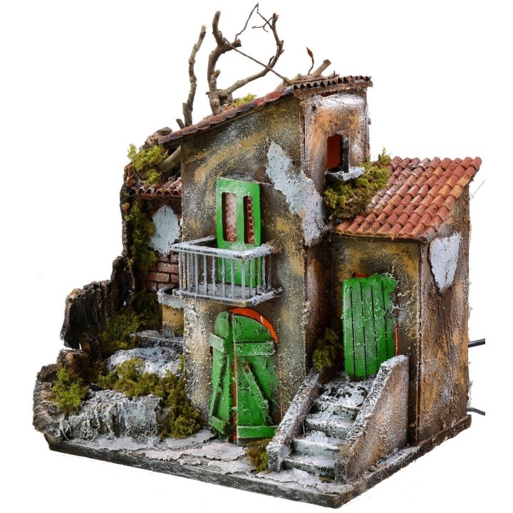 Casa iluminada con fuente funcionando de 30x21x35 cm h