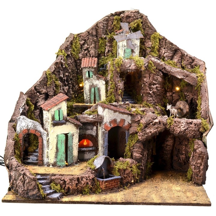 Illuminated nativity scene with functioning fountain, fire and