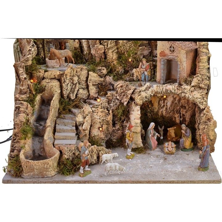 Illuminated nativity scene with grinded donkey complete with