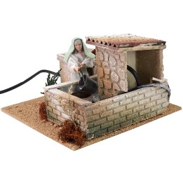 Donna alla fontana 12 cm in movimento cm 20x20x13,5 h