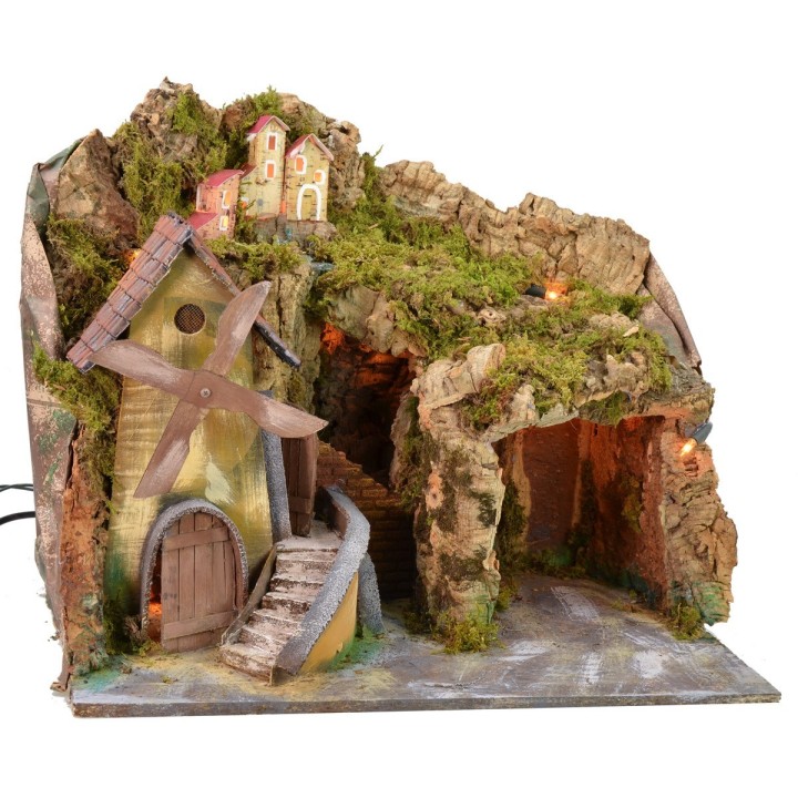 Paisaje iluminado con cueva y molino funcionando a corriente de