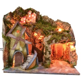 Paesaggio illuminato con grotta e mulino funzionante a corrente