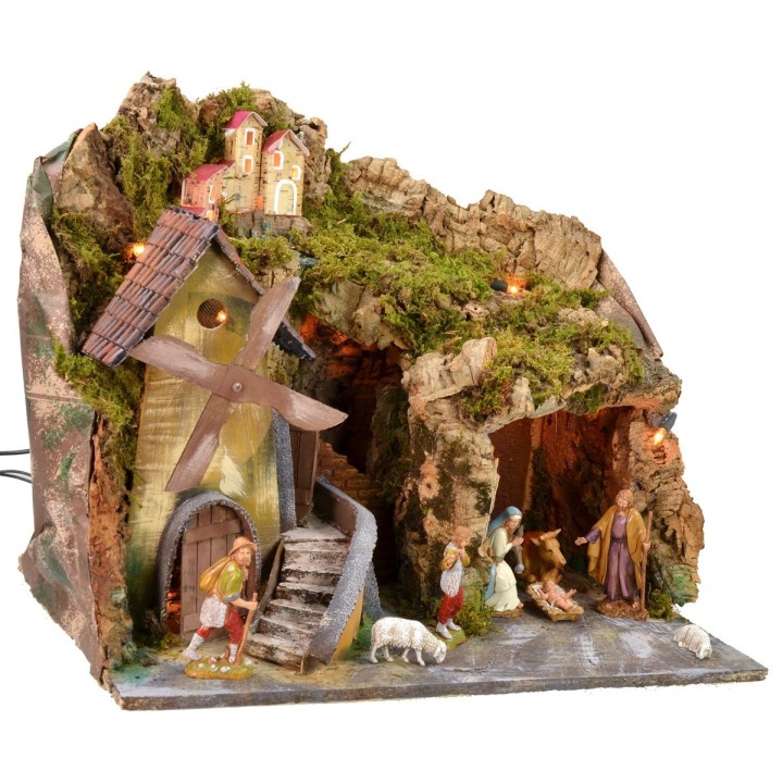 Classic illuminated nativity scene with grotto and mill running