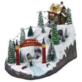 Escenario navideño con pista de esquí funcionando con baterías