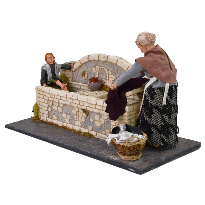Lavandaia 30 cm con bambino con doppio movimento e fontana