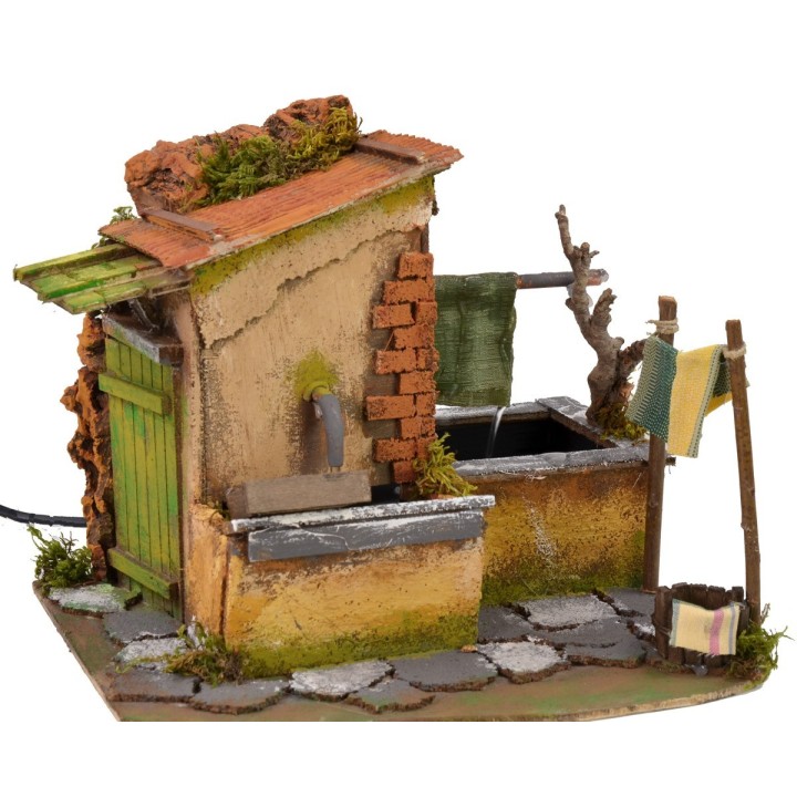Casa con stenditoio gocciolante e fontana funzionante cm