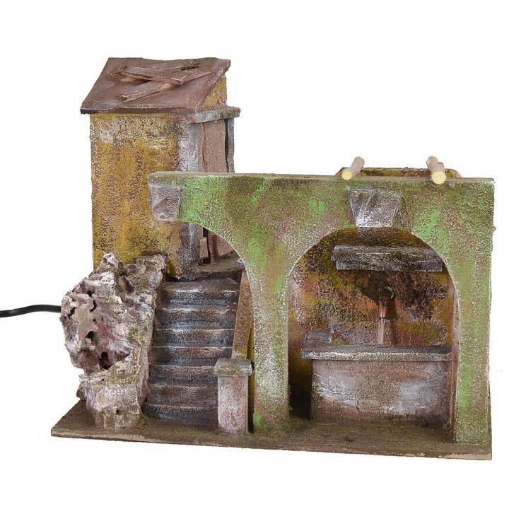 Porzione di casa con fontana funzionante e archi per presepe cm