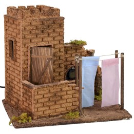 Casa con panni stesi effetto vento cm 27x19x24,5 h.