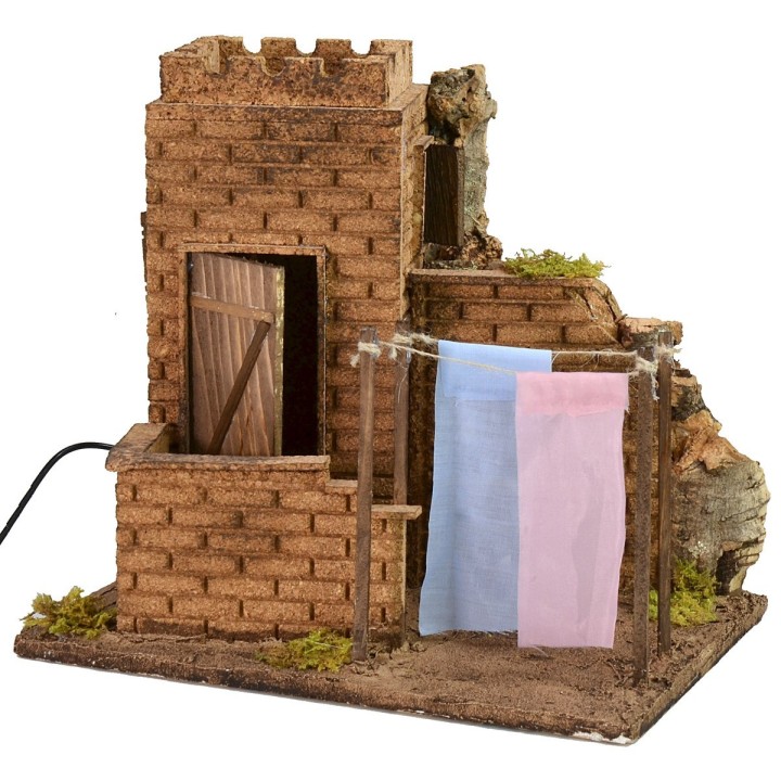 Casa con ropa tendida efecto viento cm 27x19x24,5 h.