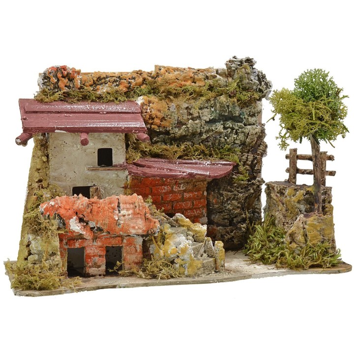 Casa estucada con leñera de 27x12x18 cm de altura.