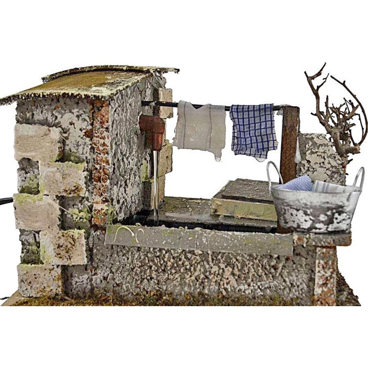 Stenditoio gocciolante con fontana presepe cm 20x14x13 h. 