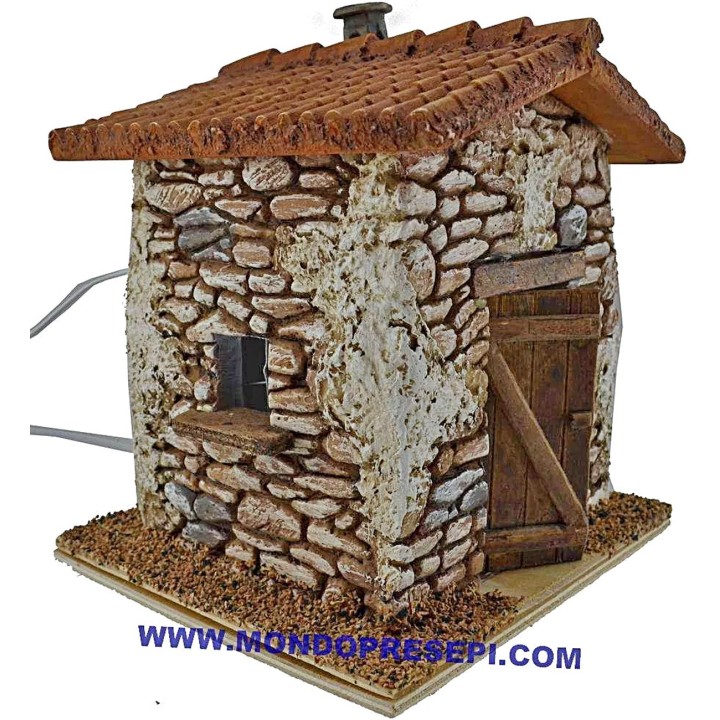 Casa de piedra con humo de 15x12x19 cm de altura.