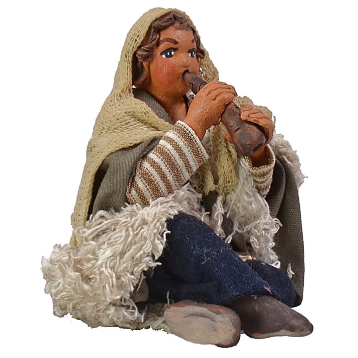 Boy sitting with pipe 12 cm Lux series