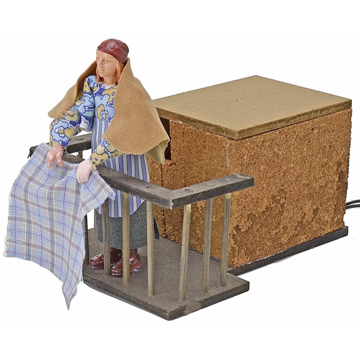 Woman 12 cm on the balcony flapping clothes in movement cm