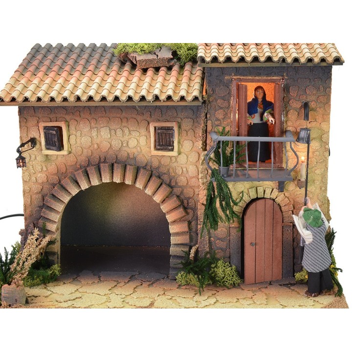 Illuminated house with moving lamplighter 12 cm and woman