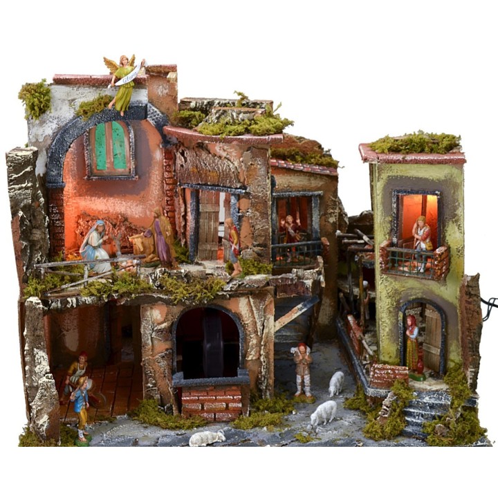 Pesebre completo con estatuas, pueblo iluminado, horno y fuente