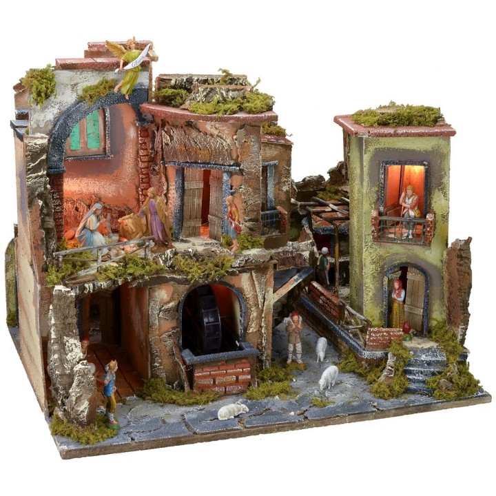 Nativity scene complete with statues with illuminated village