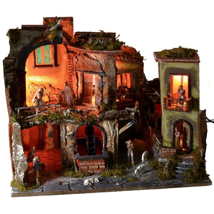 Nativity scene complete with statues with illuminated village