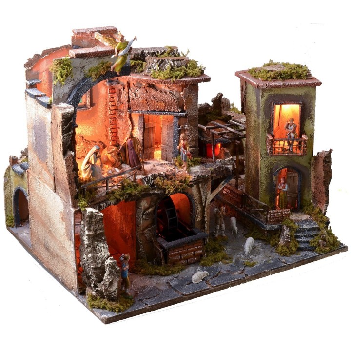 Nativity scene complete with statues with illuminated village