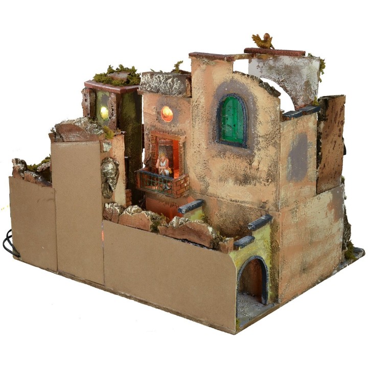Pesebre completo con estatuas, pueblo iluminado, horno y fuente