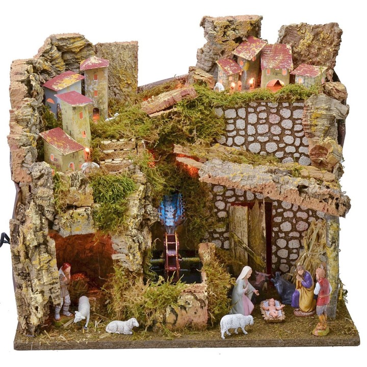 Illuminated village complete with Landi statues with