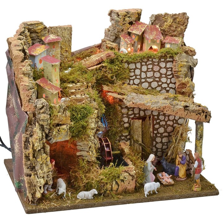 Illuminated village complete with Landi statues with