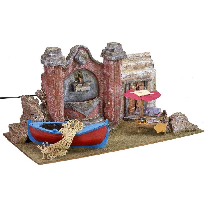 Setting with current-operated fountain, fisherman's boat and
