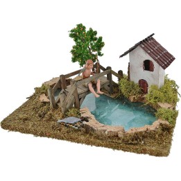 Estanque con efecto profundidad pescador Landi, árbol y casa