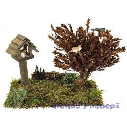 Prato con casetta e albero con uccelli