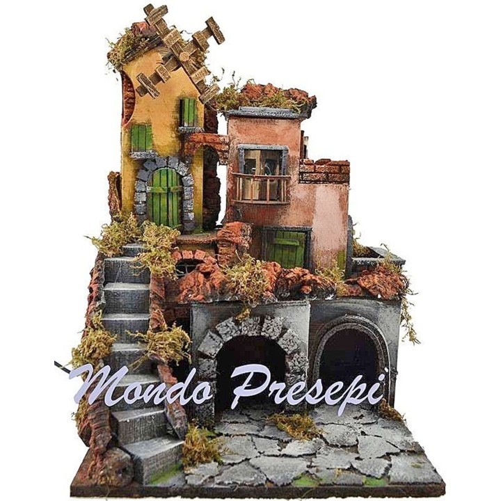 The crib with the village lit up and the mill 30x30x40 h.