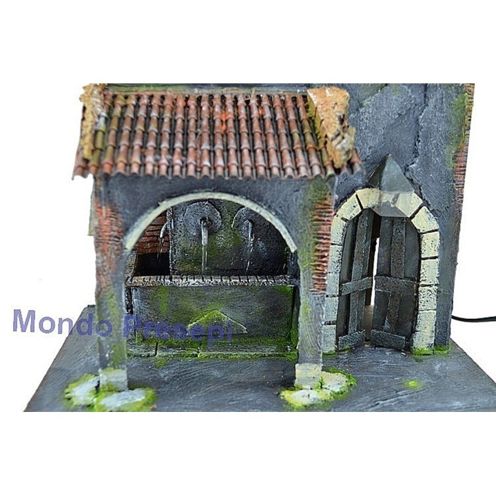 Casa con fuente de 3 salidas de agua y farola