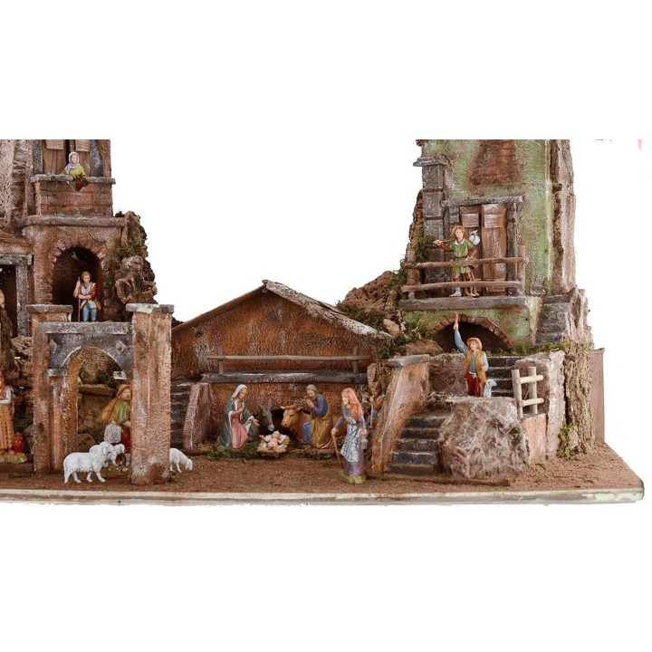 Full illuminated presepe of Landi statues with houses and