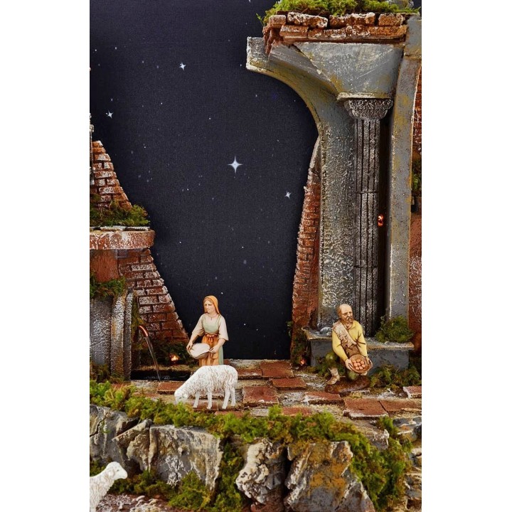 Belén completo de figuras Landi con cielo estrellado iluminado