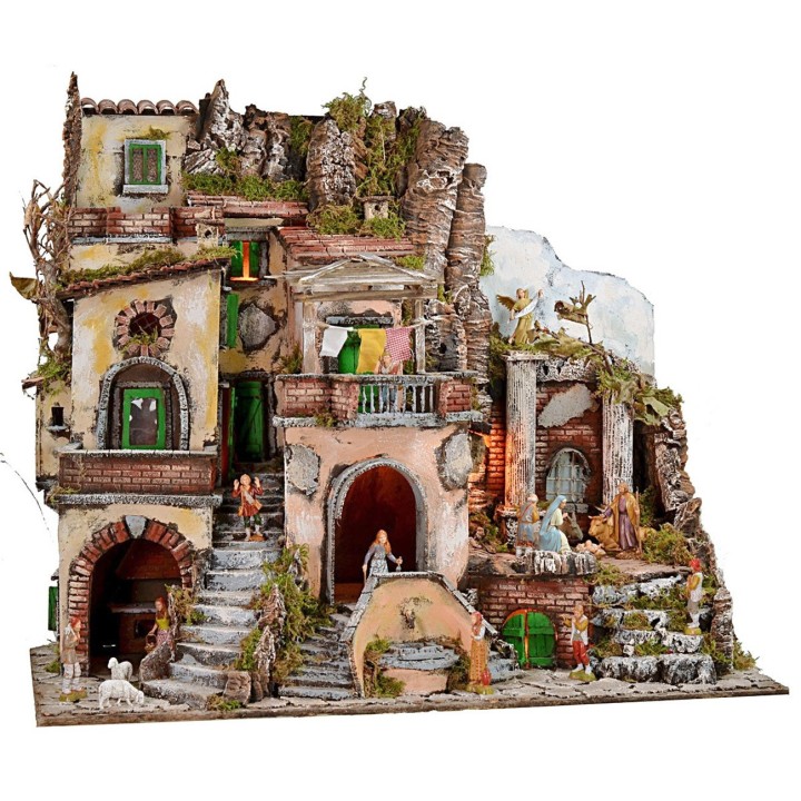 Illuminated nativity scene with fountain and working fire