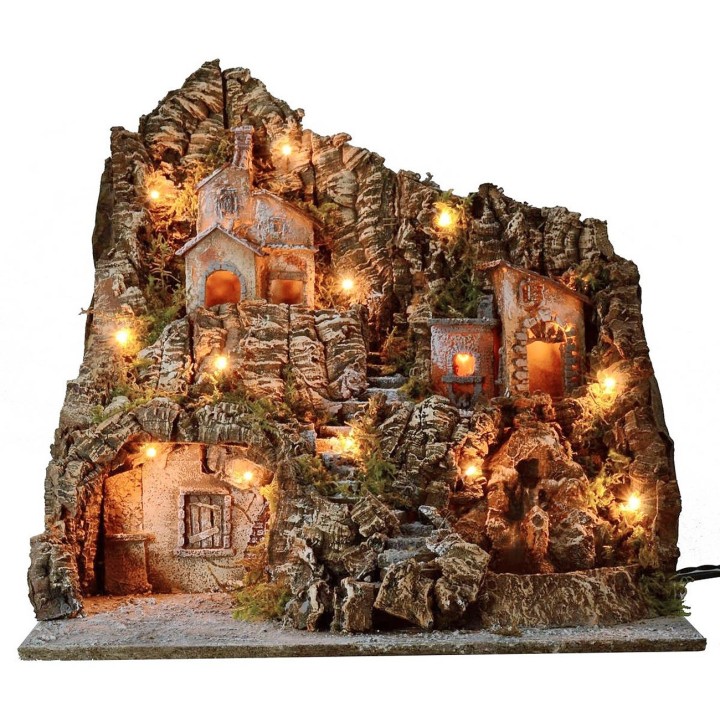 Illuminated nativity scene with functioning oven and waterfall