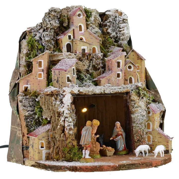 Illuminated snow-covered nativity scene complete with Landi