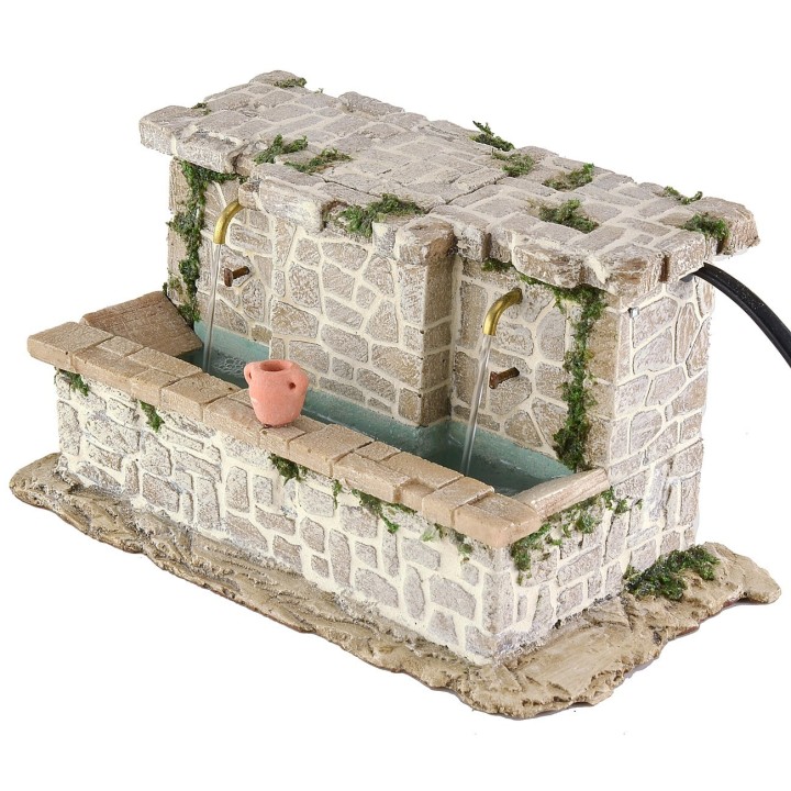 Lavadero de piedra con 2 grifos y cubos