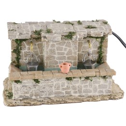 Lavadero de piedra con 2 grifos y cubos