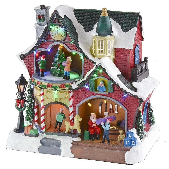 Christmas scenario with little house and carousel complete with