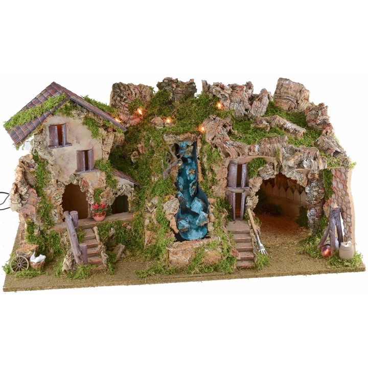Illuminated nativity scene with cave, waterfall and fire