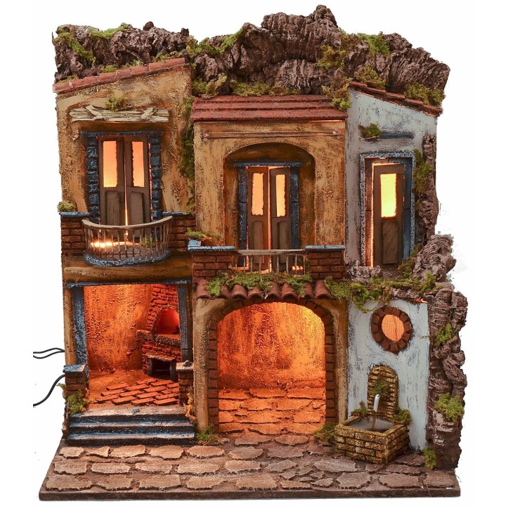 Pueblo iluminado con horno y fuente en funcionamiento estilo