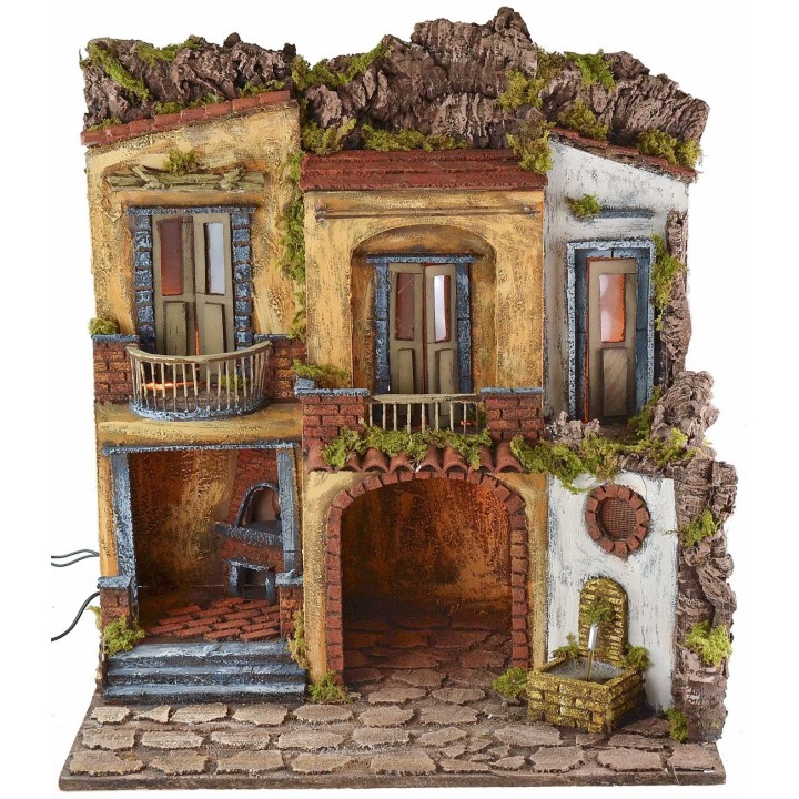 Pueblo iluminado con horno y fuente en funcionamiento estilo