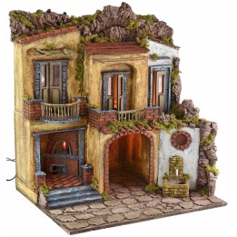 Pueblo iluminado con horno y fuente en funcionamiento estilo