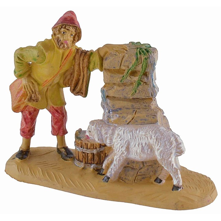 Shepherd at the fountain with lamb 8 cm in PVC