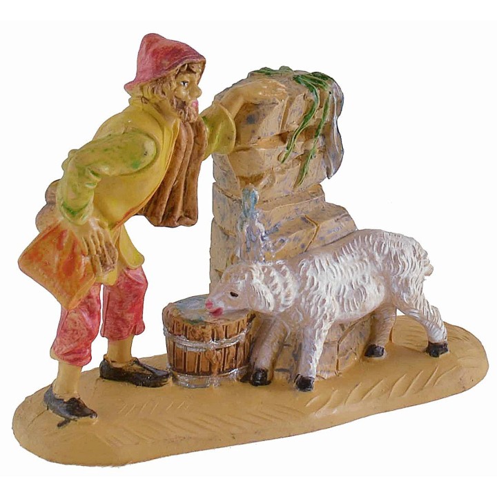 Shepherd at the fountain with lamb 8 cm in PVC