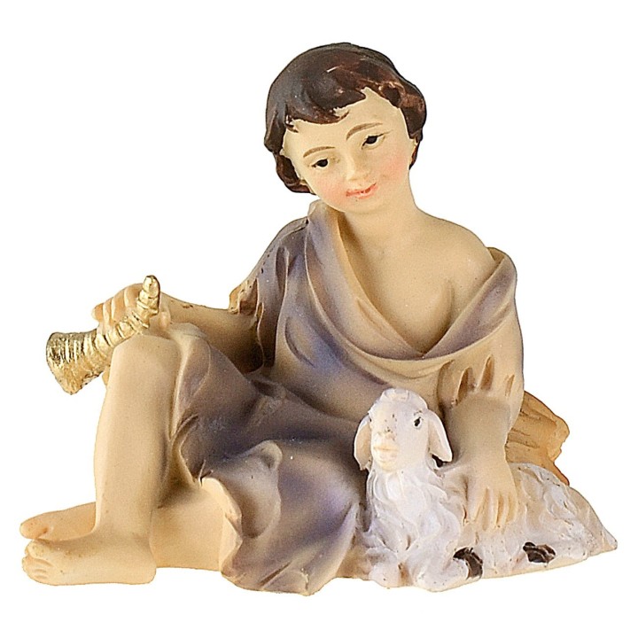 Niño sentado con cordero serie 12 cm en resina