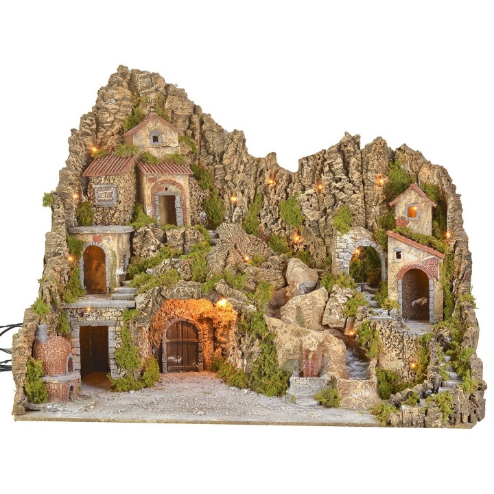 Illuminated nativity scene with cave, fountain, waterfall and