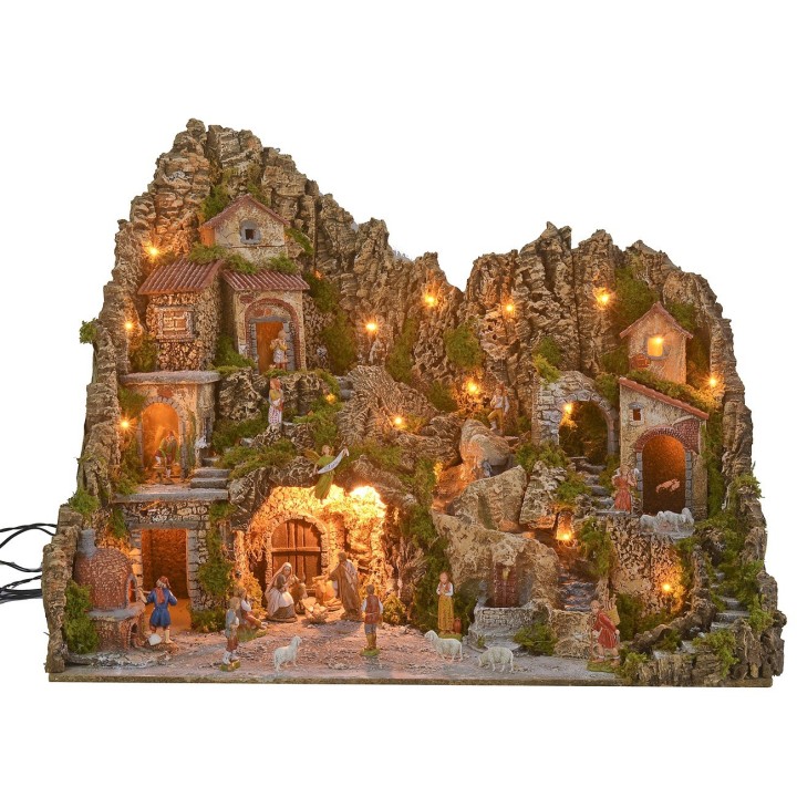 Illuminated nativity scene with a grotto, fountain, waterfall